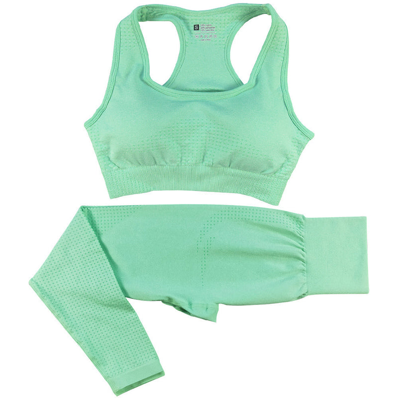 Mint green women’s high-waist gym set with a seamless sports bra and leggings. Stretchy, quick-dry fabric for workouts and activewear comfort.