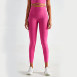 Bright pink high-waisted yoga pants with a slim fit and moisture-wicking fabric. Perfect for workouts and casual wear. Available in various sizes.