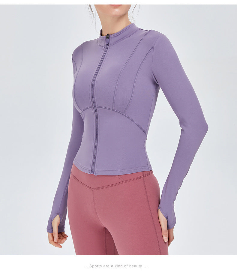 Purple women's yoga sports top with long sleeves and a zip-up front. Ideal for fitness and yoga, offering moisture-wicking comfort.