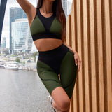 Green and black high waist sports leggings with matching sport bra. Ideal for fitness, yoga, and running.