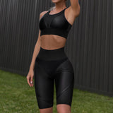 Black high waist sports leggings and sport bra set. Perfect for workouts, gym sessions, and casual athleisure wear.