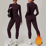 Full-body view of a warm yoga jumpsuit in deep purple, showcasing front and back design. Moisture-wicking polyester fabric for comfort and flexibility.