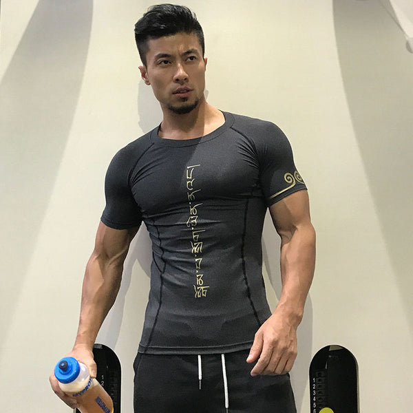 Men's tight-fitting running shirt in black with gold lettering. Breathable, sweat-wicking fabric for fitness and active wear.