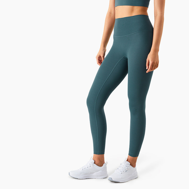 Dark green high-waisted yoga pants with a slim fit and moisture-wicking material. Designed for comfort and flexibility during workouts.