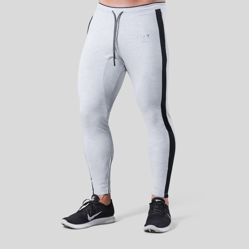 Fitness pants for men made of polyester, designed for workouts. Available in light gray with black side stripes, featuring a drawstring waist. Sizes M-XXXL.