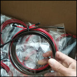 Replacement red and black jump rope cable coiled and packed in plastic. Durable and adjustable for high-speed skipping exercises.