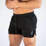 Men's fitness quick-dry shorts in black, designed for gym and outdoor use. Made from polyester with a snug fit, featuring side slits for flexibility.