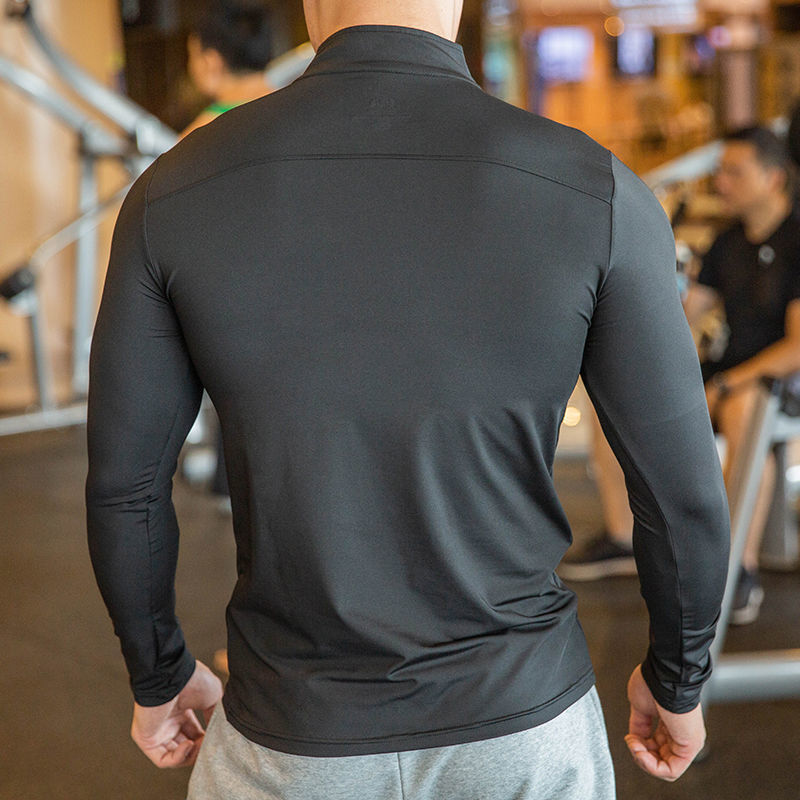 Back view of a black half-zipper fitness sweatshirt, featuring a smooth finish and ergonomic fit for enhanced performance.