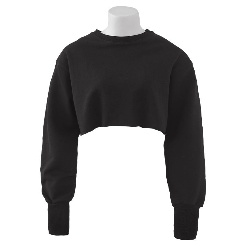 Black women's cotton fitness crop top with long sleeves and round collar. A versatile choice for gym or casual wear.