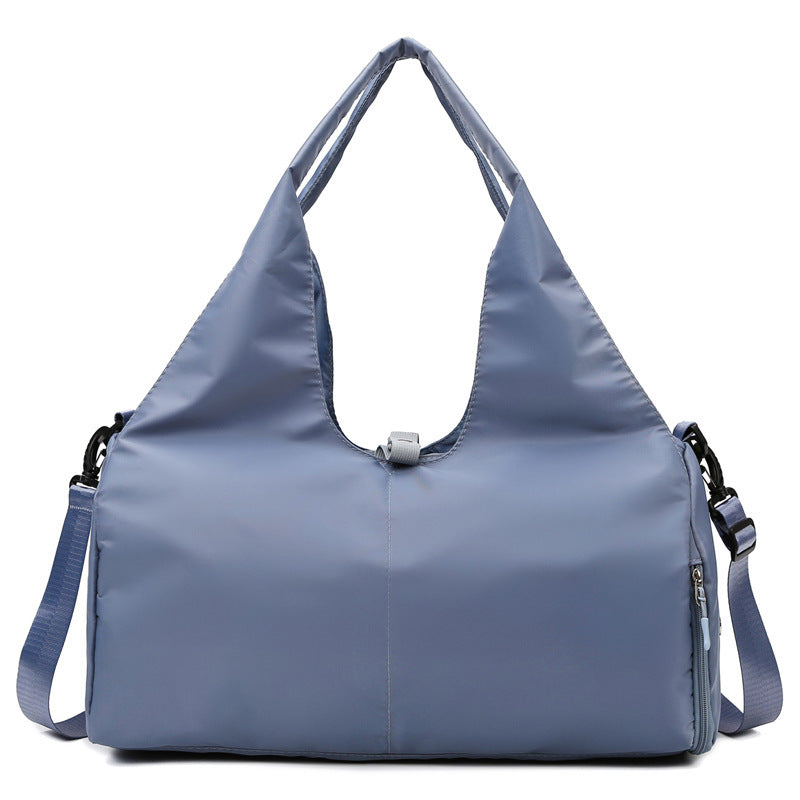 Blue women's large yoga bag with a durable Oxford fabric, spacious interior, and detachable shoulder strap for easy carrying.