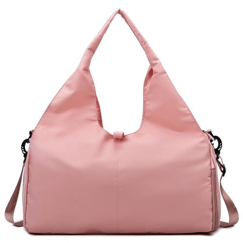 Soft pink women's large yoga bag with a stylish and functional design, perfect for carrying gym or yoga essentials with ease.