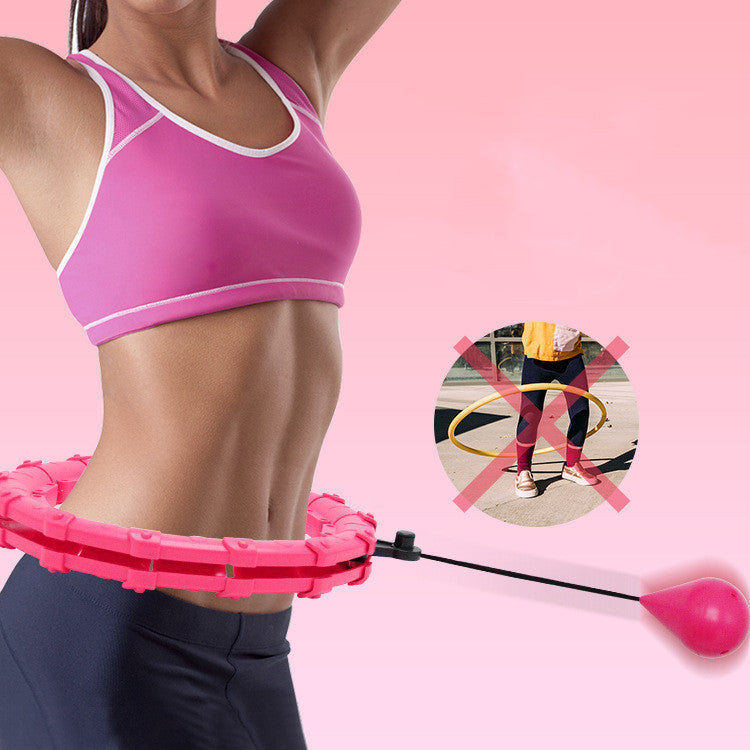 Adjustable Fitness Ring in pink, worn by a woman for abdominal exercise. Features a weighted ball for fat loss and no-fall design.