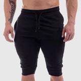 Men's sports cotton shorts in black with drawstring waist and zippered pockets. Ideal for summer fitness, available in sizes M to XXL.