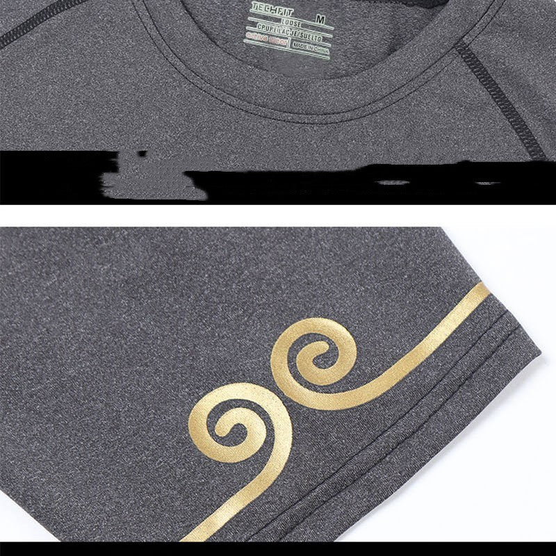 Detailed view of gray fitness shirt with gold sleeve design. Soft, sweat-wicking fabric with durable stitching.