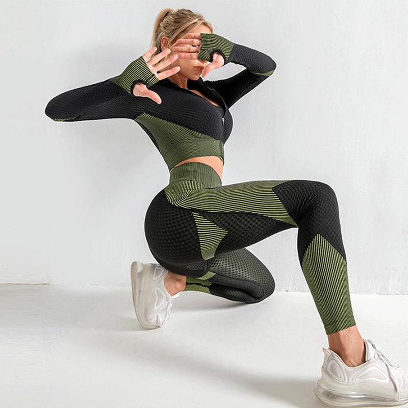 Black and green seamless yoga set for women. High-waisted leggings and zip-up jacket designed for comfort, flexibility, and quick-dry performance.