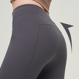 Close-up of dark gray high waist slimming trousers, highlighting the lifting effect on the back. Designed for a sculpted and flattering fit.