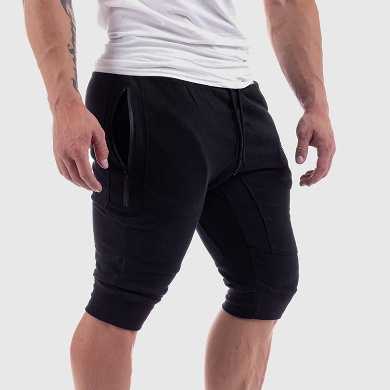 Black men's summer fitness shorts with zippered pockets and a snug fit. Made of breathable cotton, available in sizes M to XXL.