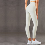 Moisture-wicking yoga pants in off-white with a high waist and slim fit. Ideal for fitness, running, and sports. Available in multiple sizes.