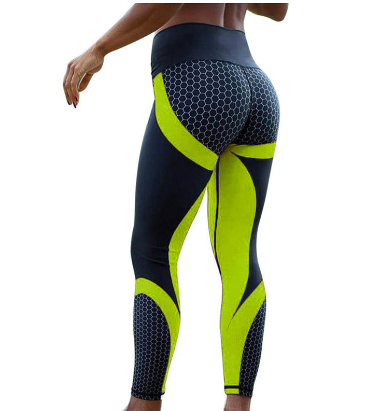 Black and yellow seamless leggings with a honeycomb pattern, offering a stylish and comfortable fit for fitness activities.