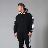 Black sports fitness pullover with white striped sleeves, worn by a model. Stylish cotton hoodie available in sizes S-3XL.