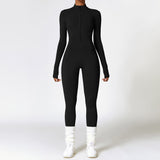 Black yoga jumpsuit with long sleeves and a front zipper. Designed with moisture-wicking polyester for warmth and flexibility during workouts.