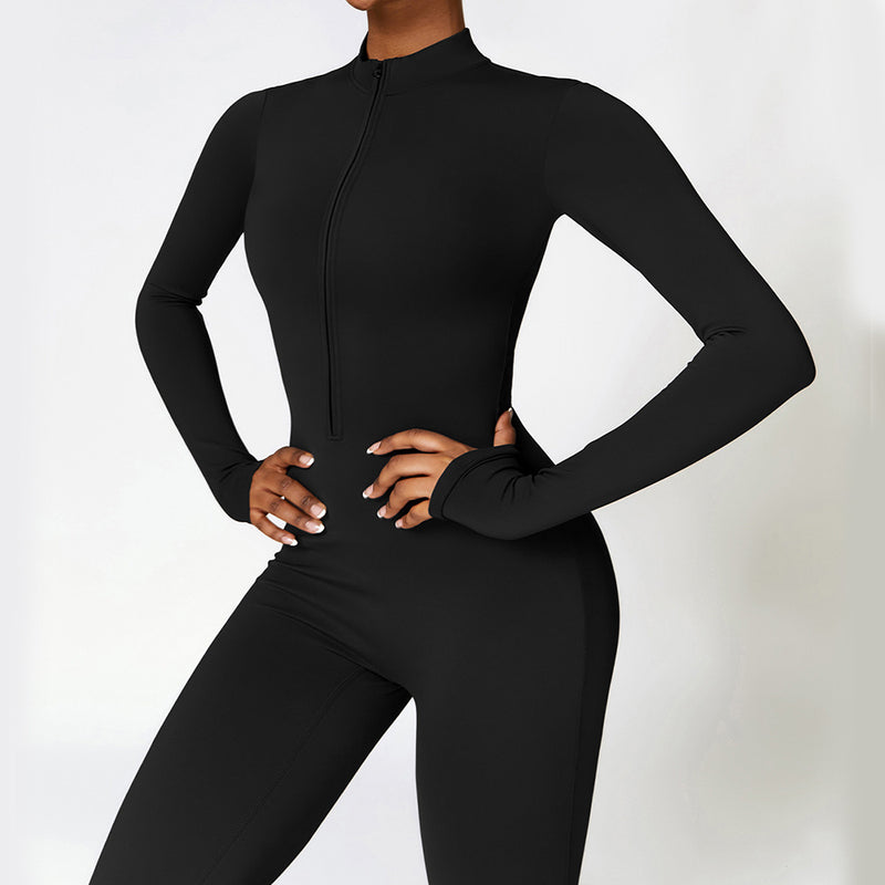 Black long-sleeve yoga jumpsuit with a front zipper. Moisture-wicking polyester fabric ensures comfort and flexibility for workouts.