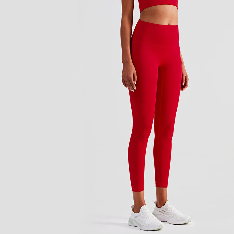 Red slim fit yoga pants with a high waist and breathable fabric. Designed for comfort and flexibility during workouts. Multiple sizes available.