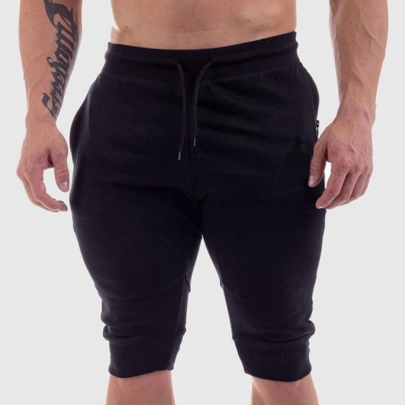 Men's black summer fitness shorts with a tapered fit and zippered pockets. Breathable cotton fabric, available in sizes M to XXL.