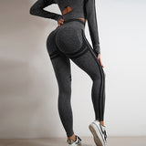 Seamless yoga pants and long sleeve top set in dark gray. Butt-lifting, slim-fit workout sportswear ideal for gym and casual wear.