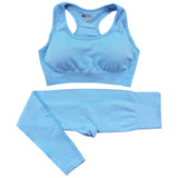 Light blue women’s gym tracksuit set with a seamless sports bra and high-waist leggings. Quick-dry, breathable fabric for fitness and activewear.