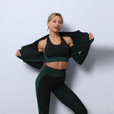 Dark green seamless yoga set for women. High-waisted leggings and zip-up jacket designed for comfort, flexibility, and quick-dry performance.