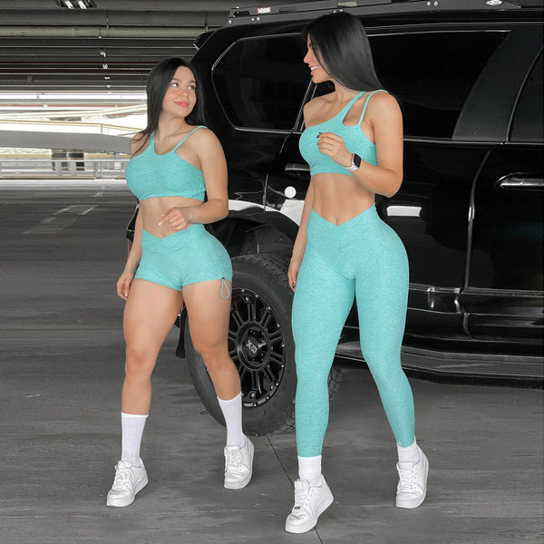 Mint green gym sportswear set featuring a bra and shorts, perfect for yoga and fitness. Stylish and comfortable activewear for workouts.