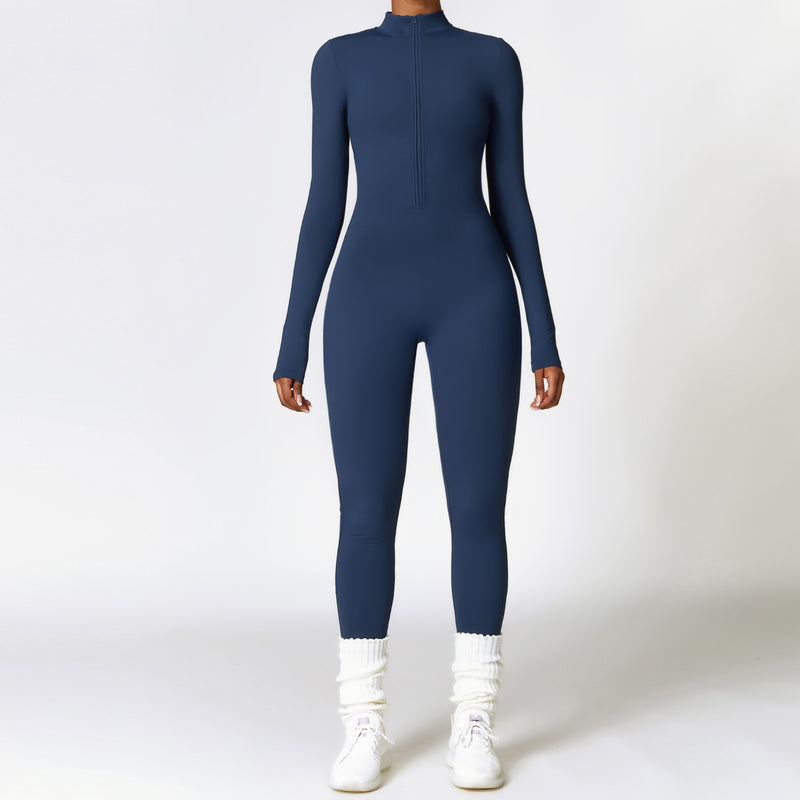 Navy blue long-sleeve yoga jumpsuit with a front zipper. Designed with moisture-wicking polyester for warmth and flexibility during workouts.