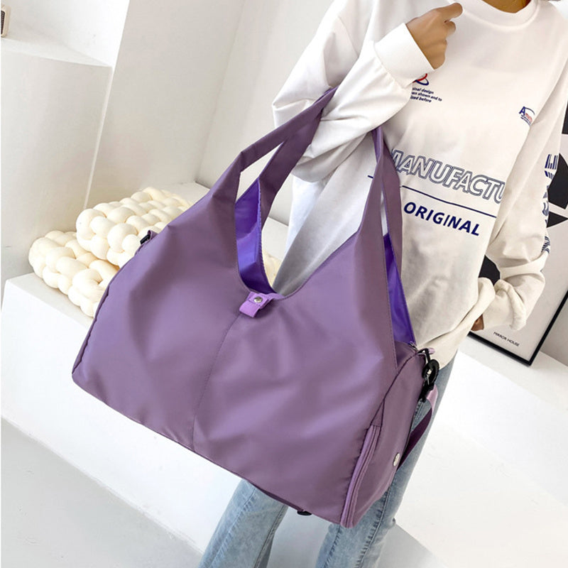 Purple women's large yoga bag with a stylish dual-handle design, durable material, and ample space for gym or yoga accessories.