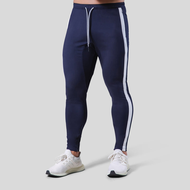 Fitness pants for men made of polyester, featuring a slim fit design with white side stripes. Available in sizes M-XXXL for workout and fitness activities.