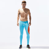 Men's sports pants - tight stretch fitness leggings in light blue with orange side panel. Breathable nylon fabric, ideal for running and gym workouts.