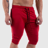 Men's summer fitness shorts in red with a tapered fit and zippered pockets. Comfortable cotton fabric, available in sizes M to XXL.