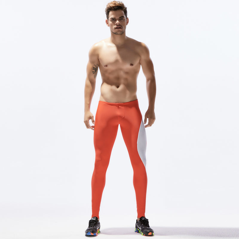 Men's sports pants - tight stretch fitness leggings in breathable nylon. Ideal for running and gym workouts, available in multiple colors.