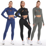 Seamless long sleeve workout outfits in blue, black, and gray. High-waisted leggings and cutout sports bras provide a stylish and functional gym look.