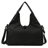 Black women's large yoga bag with a minimalist design, durable Oxford fabric, and ample storage space for gym or yoga essentials.