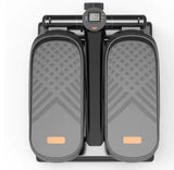 Top view of black mini stepper with LCD monitor and textured foot pedals, designed for compact home fitness workouts.