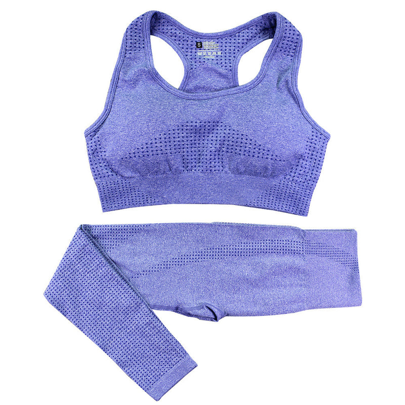 Purple women’s gym tracksuit set with a seamless sports bra and high-waist leggings. Quick-dry fabric, ideal for workouts and fitness activities.