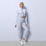 White seamless sport set for women. Quick-dry yoga suit with a zip-up jacket and high-waisted leggings, perfect for all-season activewear.