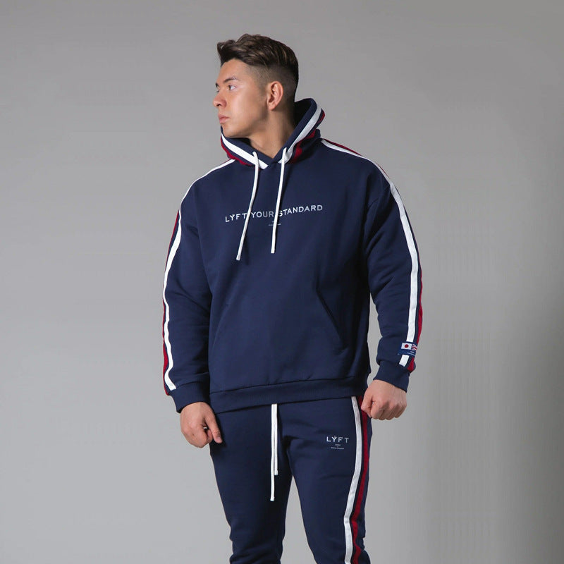 Navy blue sports fitness pullover with red, white, and blue striped sleeves and 'LYFT YOUR STANDARD' text. Cotton hoodie in sizes S-3XL.