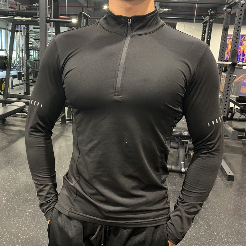 Black half-zipper fitness sweatshirt with moisture-wicking fabric, offering comfort and flexibility for gym and sports activities.