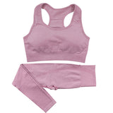 Light pink women’s high-waist gym set with a seamless sports bra and leggings. Quick-dry, stretchy fabric for comfortable workouts and activewear.